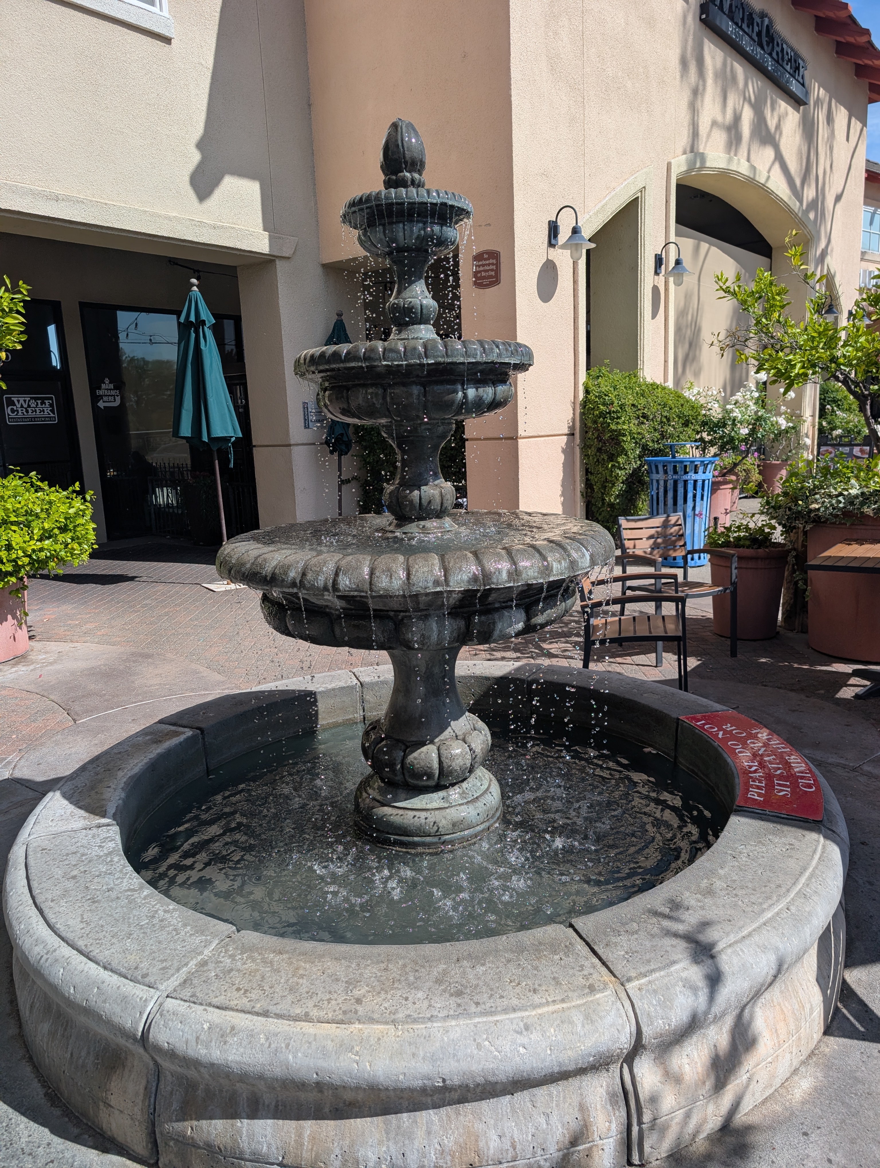 Three-tier bronze fountain at shopping center