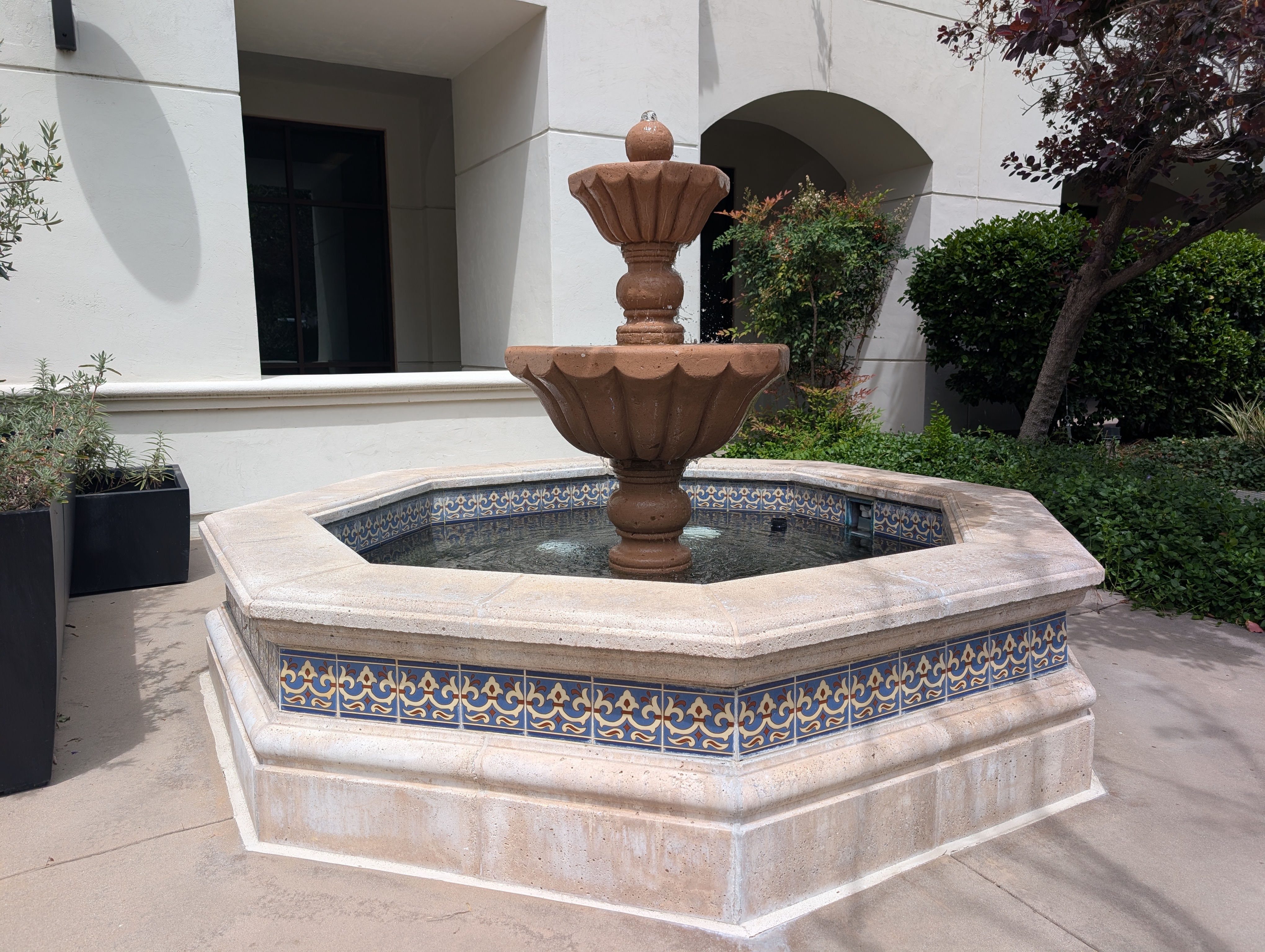 Octagonal tiled decorative fountain at commercial property